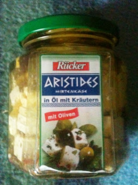Aristides mit Öl, Kräutern und Oliven